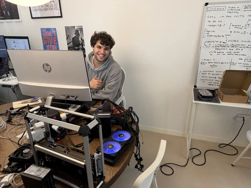 Davide at his desk, next to an open test machine