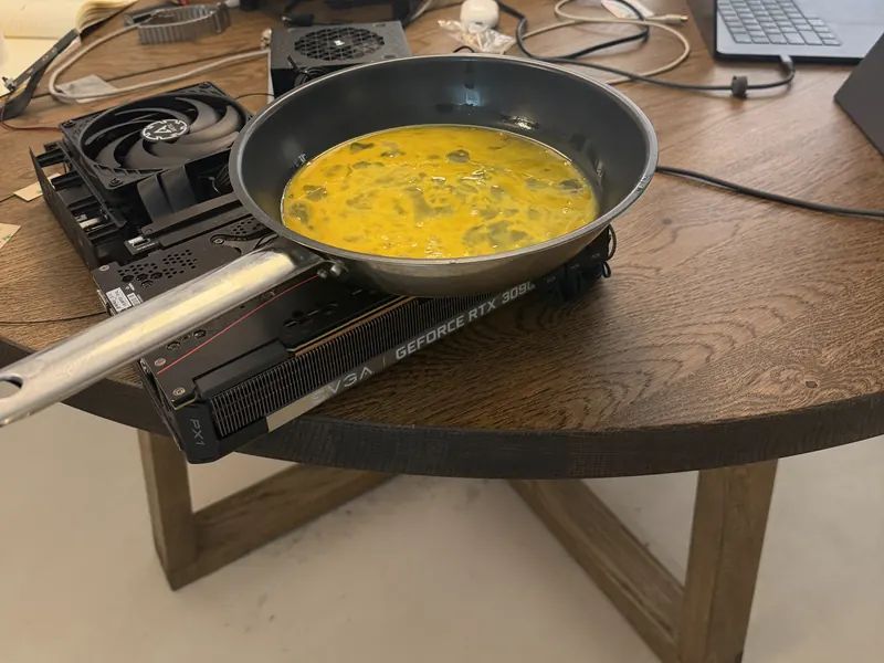 A pan with an omelette resting on a test machine
